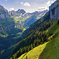 Swiss Alps and a restaurant under a cliff on mountain Ebenalp in Switzerland